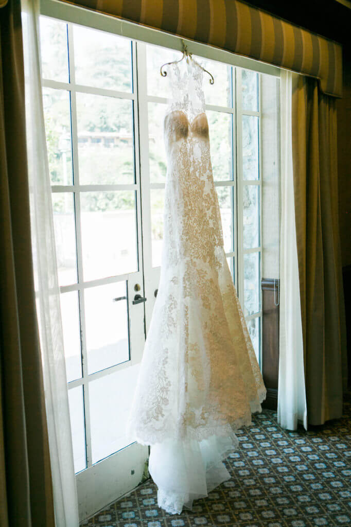 Wedding dress hanging on the window of bel Air bay Club 