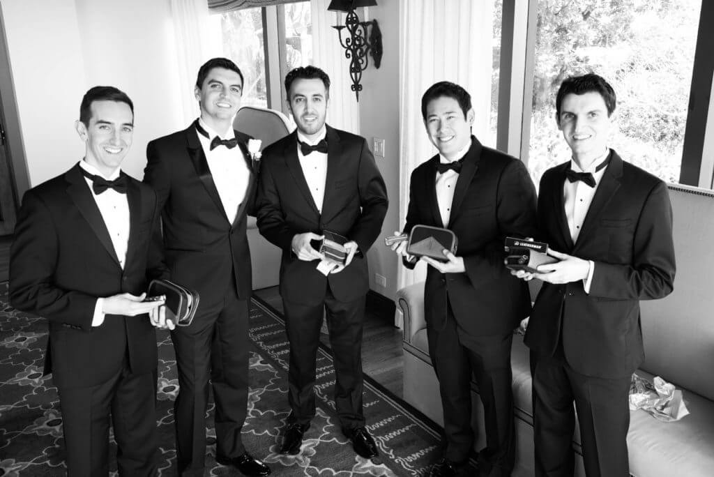 groomsman openning their gifts 