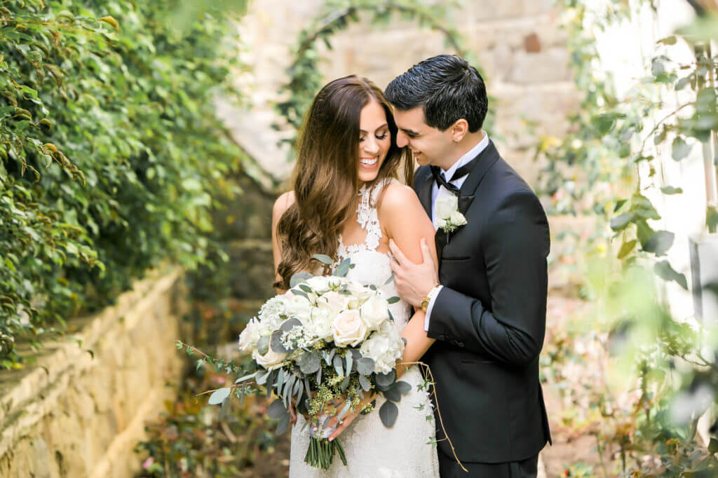 Portrait of bride and groom at Bel Air bay Club garden areas 