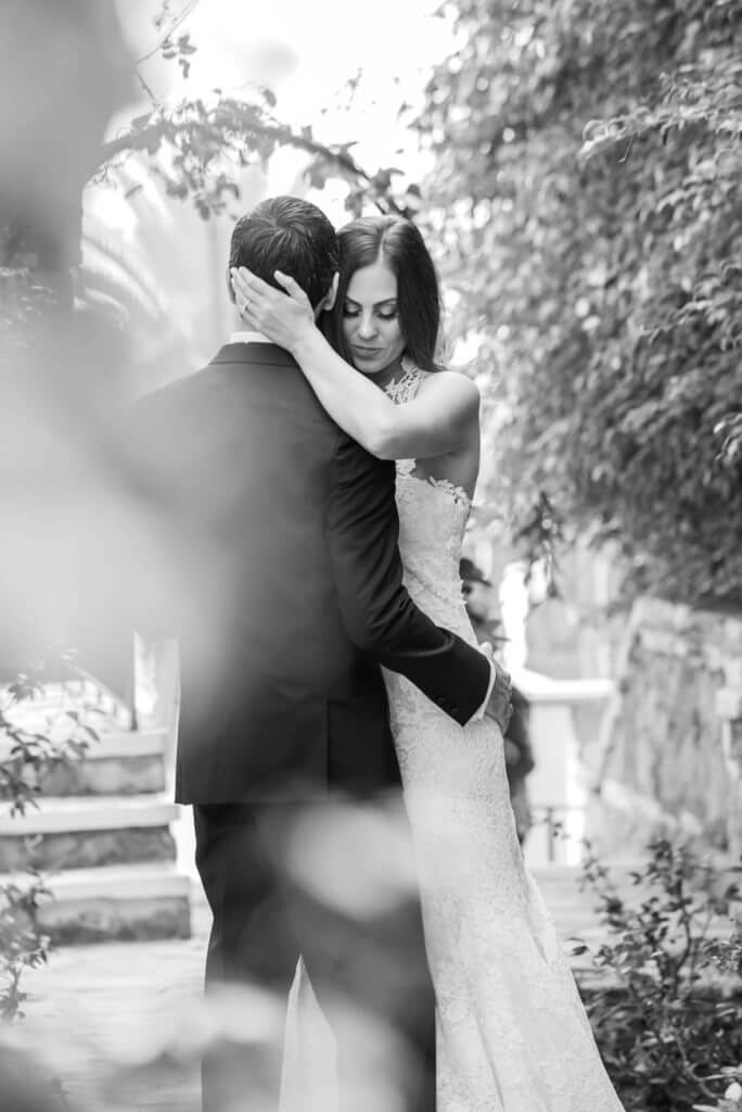 a quiet moment husband and wife kissing black and white portrait 