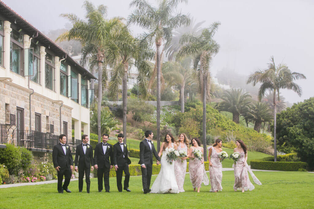 bridal party in front of pacific ocean