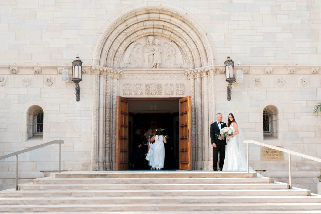 Bride is waiting to walk down the Isle nest to her father at St Monica's catholic church 