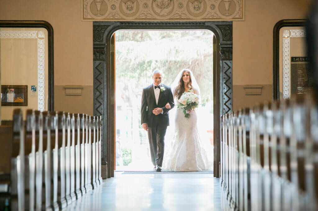 Bride and father walking down the Isle. 