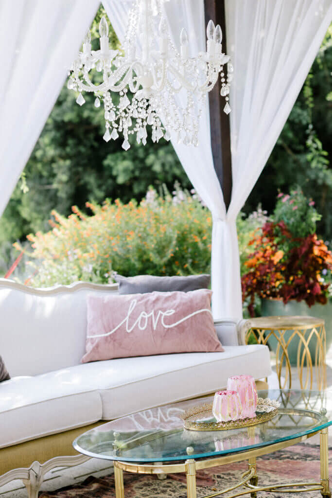 White launch area with pink pillows
