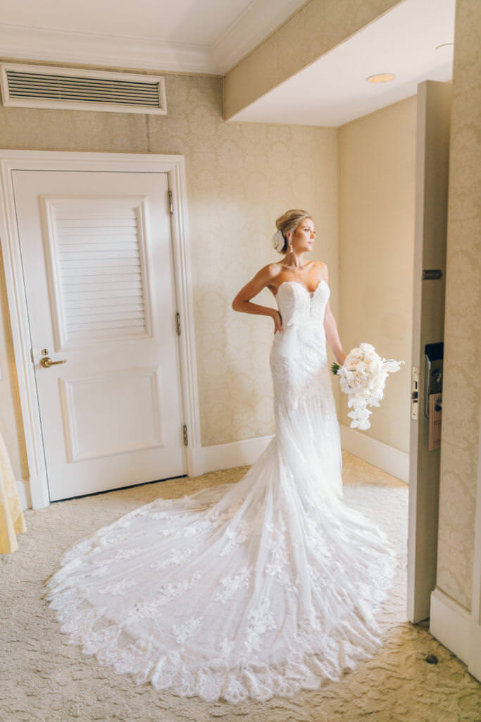 Destination wedding at Beverly Hills Hotel bride standing near the door 