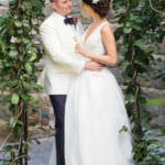bride and groom hugging on the rose garden at Bel Air Bay Club
