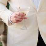 Groom holding a martini
