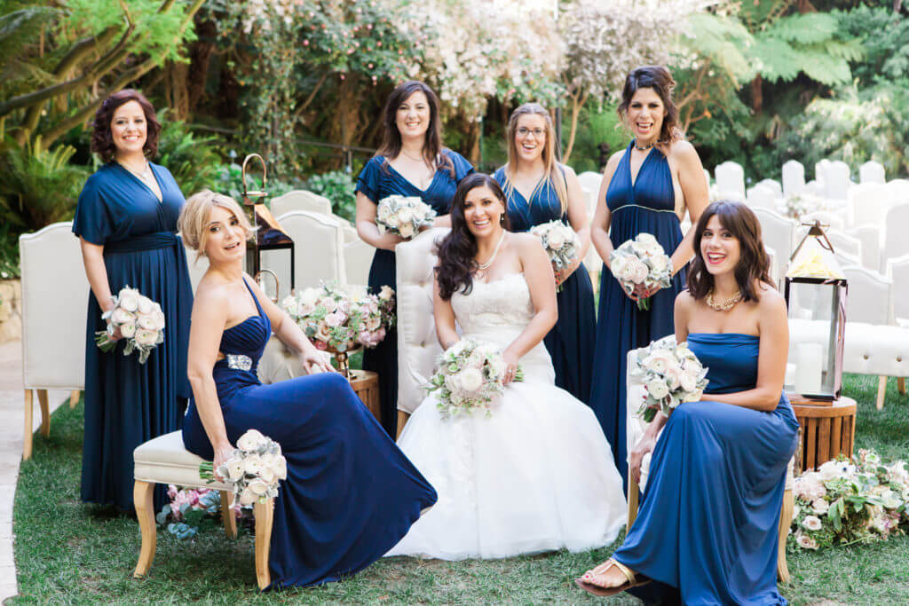 Brides maids wearing navy blue with bride