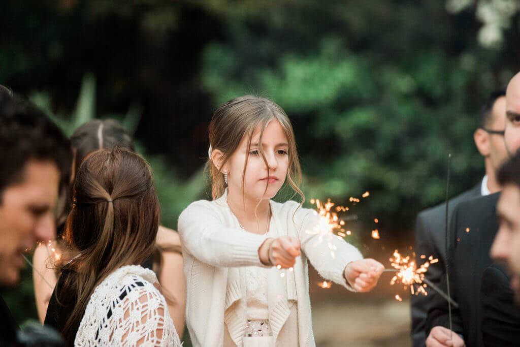 Little girl playing with sparklers