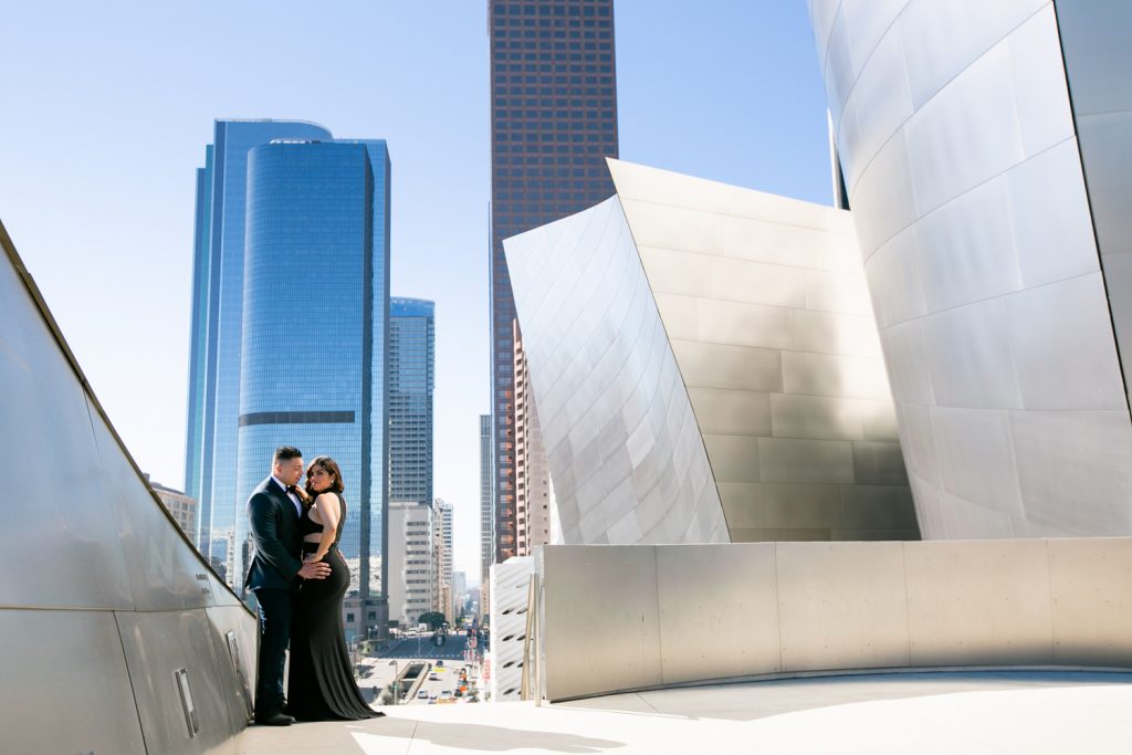 Couple standing at the Disney Concert hall on their engagament Session.