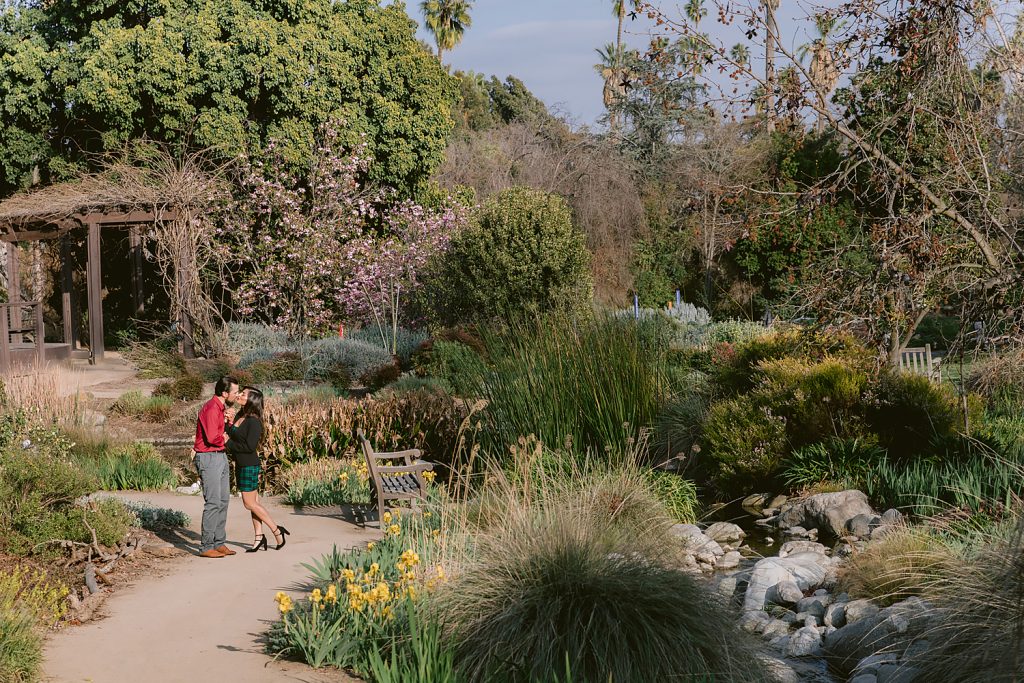 Los Angeles Arboretum Engagement Session couple kissing in the middle of the park 