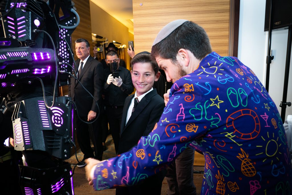 Dja nd mitzvah boy getting ready to enter the ball room at Pasea Hotel