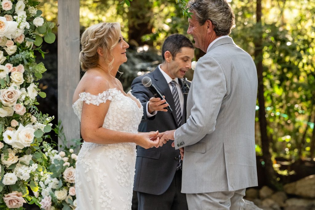 Couple holding hands during the ceremony