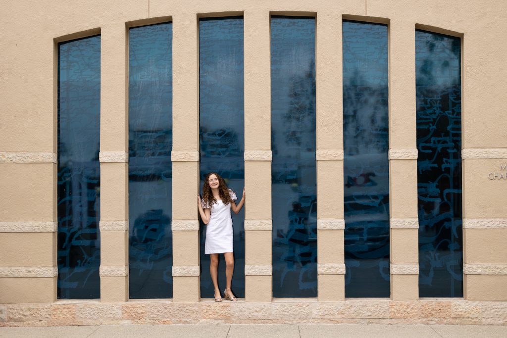 Bat Mitzvah girl wearing a white dress. 