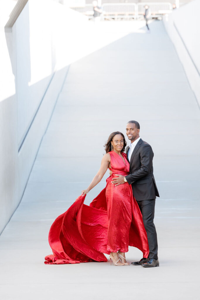 female wearing a red dress on her engagement session