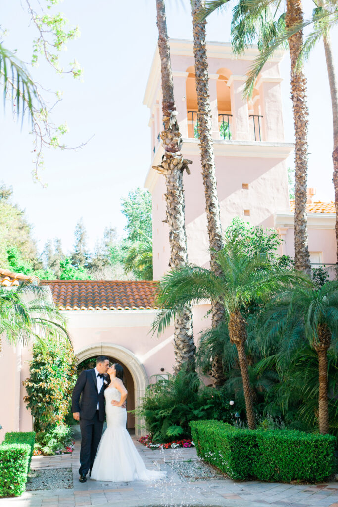 Couple kissing at the court yard at Hotel Bel Air