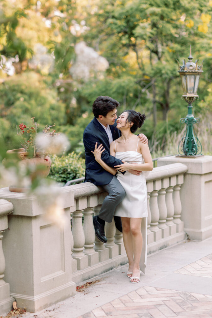 Romantic couple portrait beside the stone balustrade at Étienne Estate