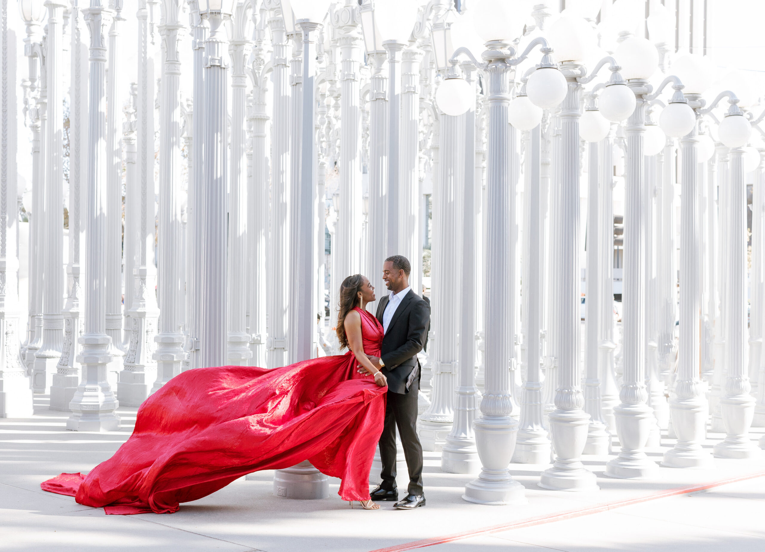 Couple in formal attire at LACMA Urban Light during a Los Angeles engagement session