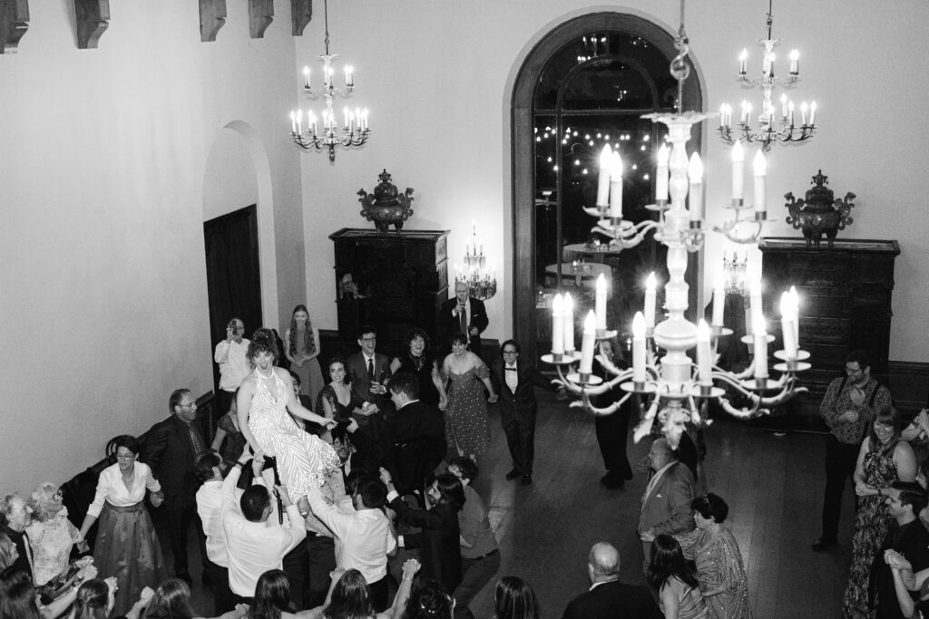 Bride lifted above the dance floor during the hora at the Paramour Estate Jewish wedding