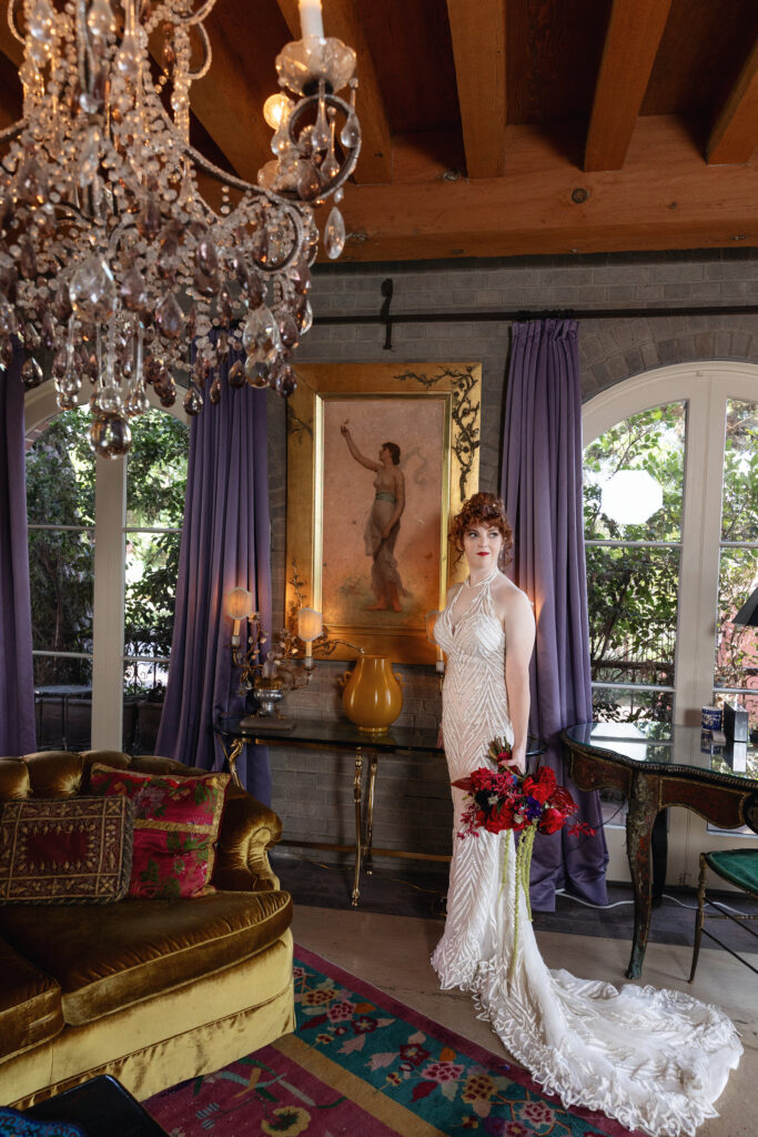 Bride in a beaded wedding gown photographed inside the richly decorated Paramour Estate